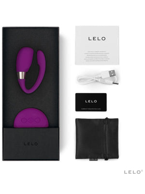 Purple LELO Tiani 3 Couples Massager with packaging, USB cable, and black pouch on a white background