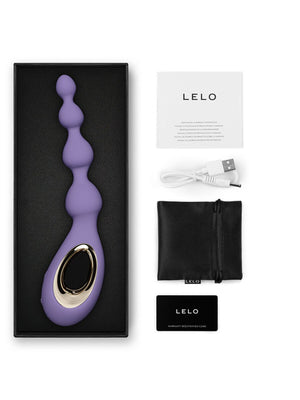 Purple electronic device with packaging and accessories on a white background