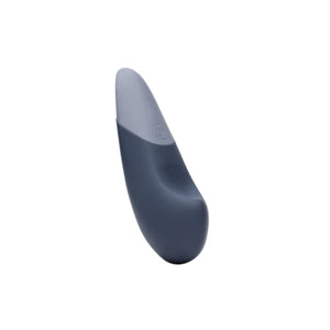 Gray and white Womanizer Vibe Massager on a white background