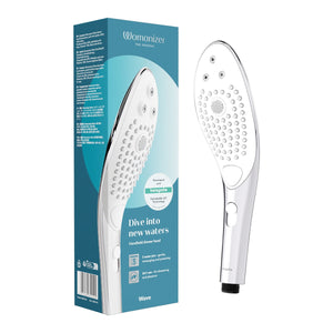 Womanizer Starlet 3 shower head with packaging displaying 'Womanizer' branding on a white background