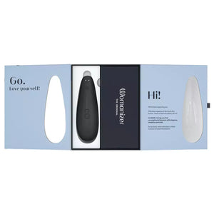 Black device in a packaging box with 'Womanizer Classic 2 Massager' branding on a white background