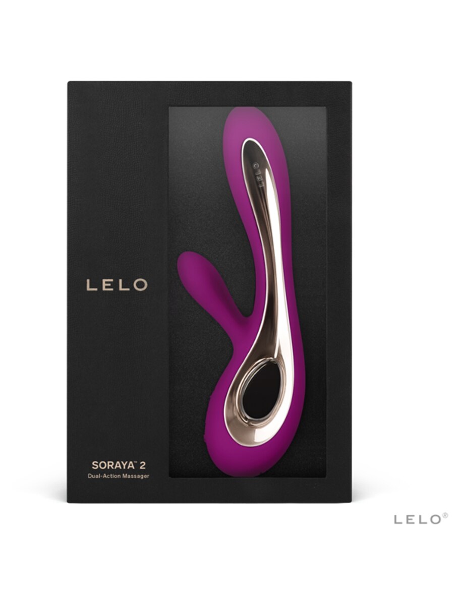 Purple and silver massager with 'Lelo Soraya 2 Deluxe' branding on a black box