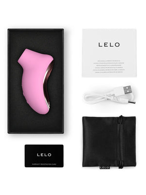 Pink LELO Sona 2 Travel Massager with packaging, USB cable, and user manual on a white background