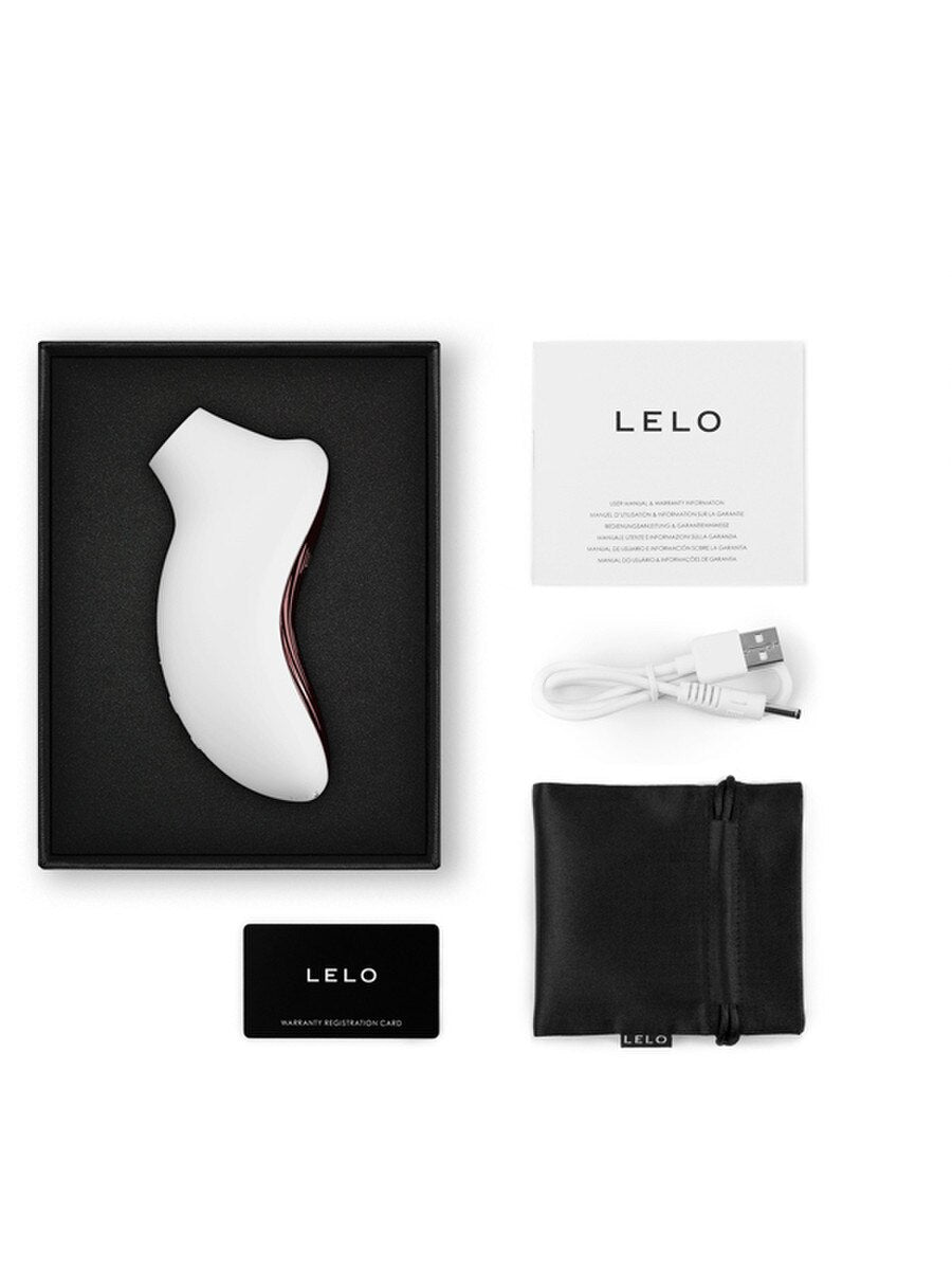Lelo Sona 3 Sonic Massager product packaging with white device, black box, USB cable, and pouch on a white background