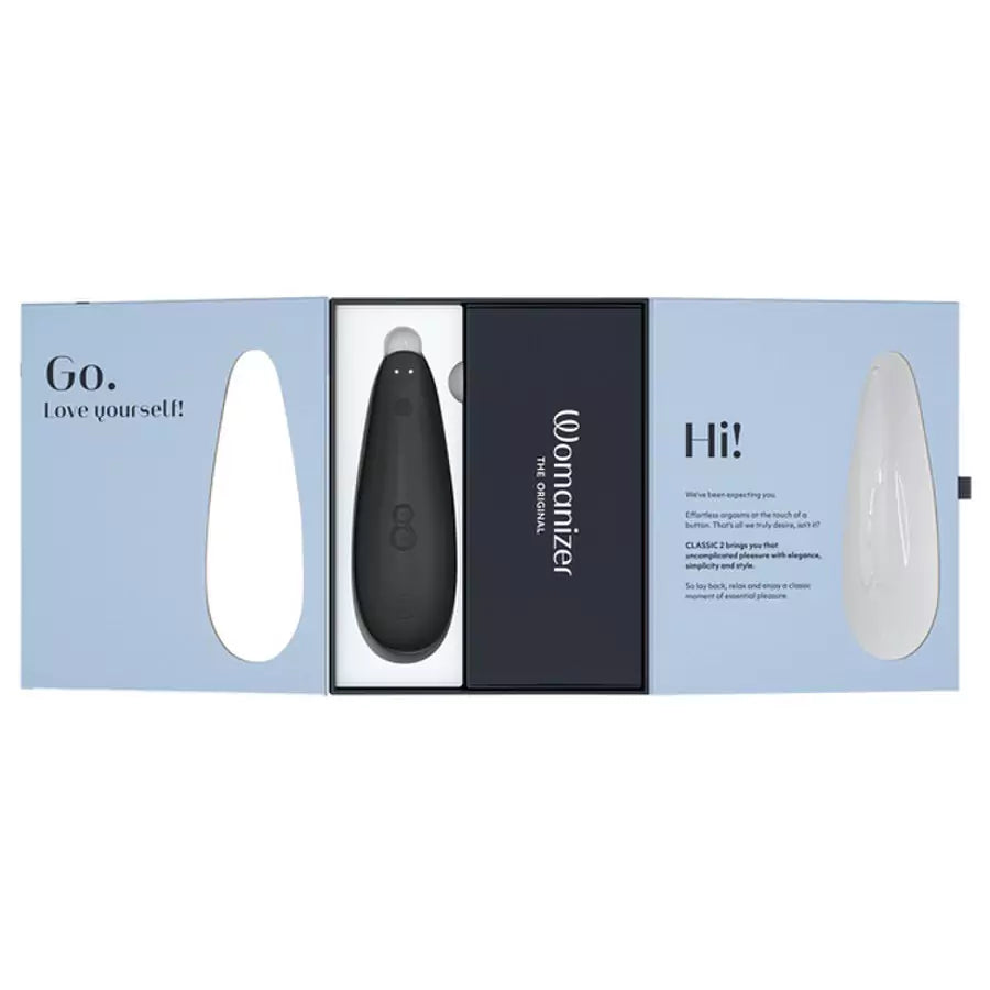Black device in a packaging box with 'Womanizer Classic 2 Massager' branding on a white background