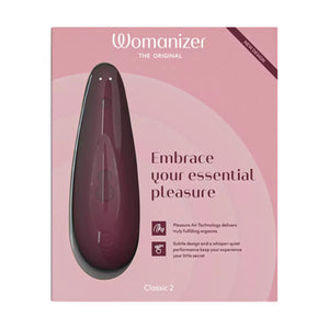 Womanizer Classic 2 Massager product packaging on a pink background