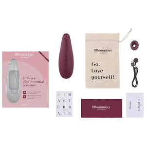 Womanizer Classic 2 Massager product set with packaging, device, and accessories on a white background