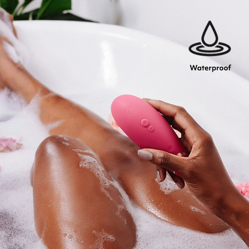 Women Use Womanizer Premium Air Pulse Clitoral Vibrator - Pink in the bathroom